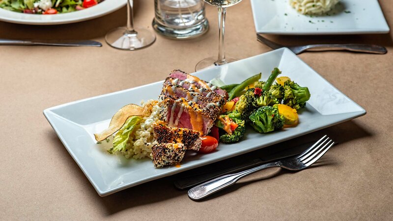 Grilled ahi tuna with side of vegetables and rice